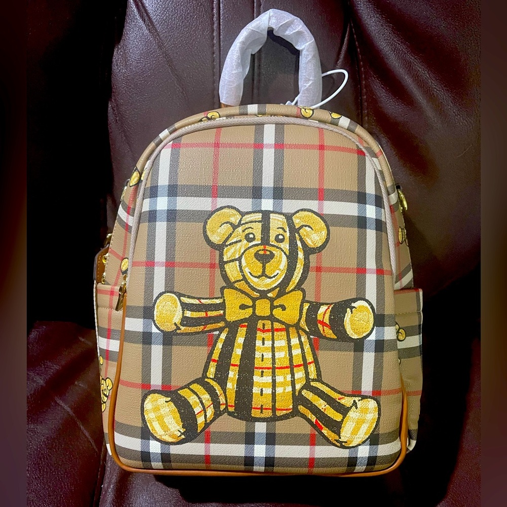 Plaid backpack with teddy bears.